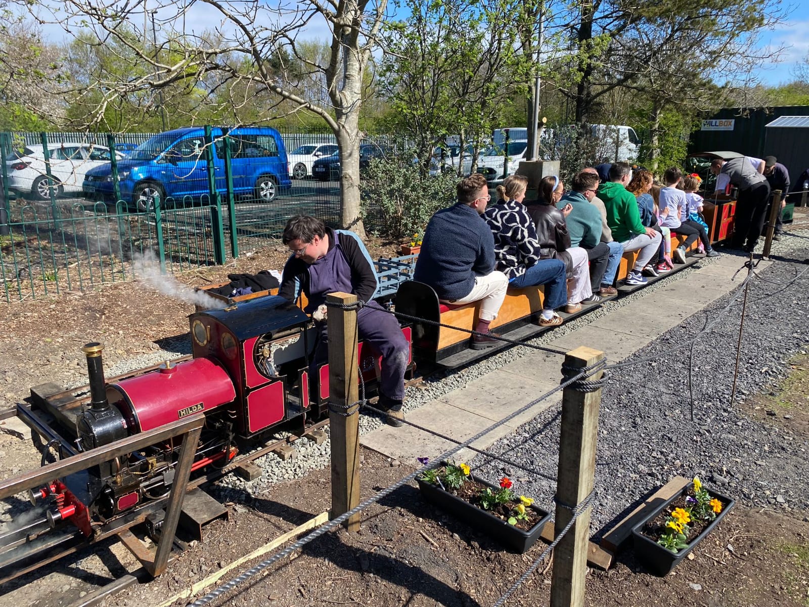 Passengers on board one of our light railway trains, hauled by visiting locomotive Hilda